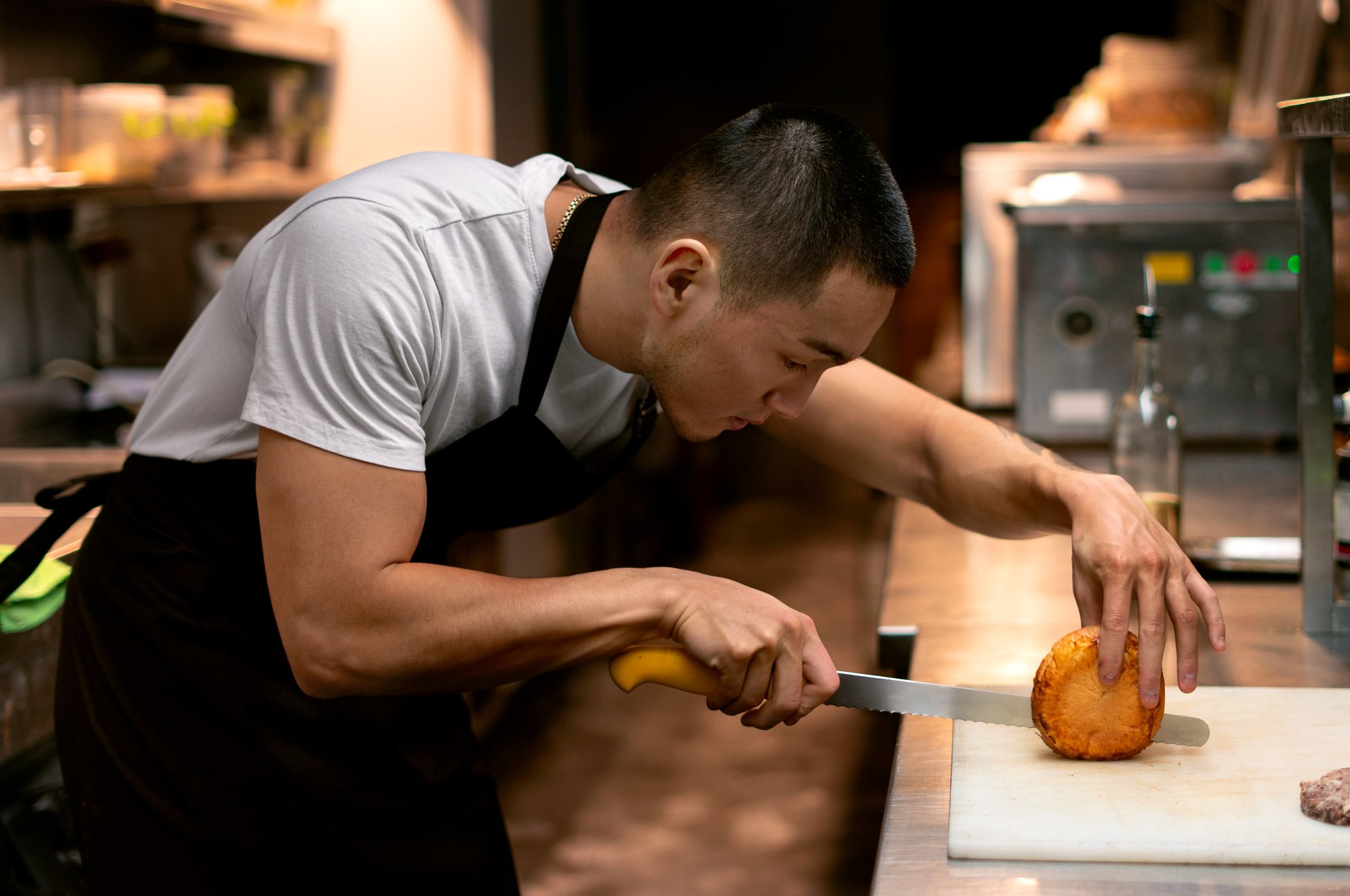 chef-cooking-kitchen-while-wearing-professional-attire